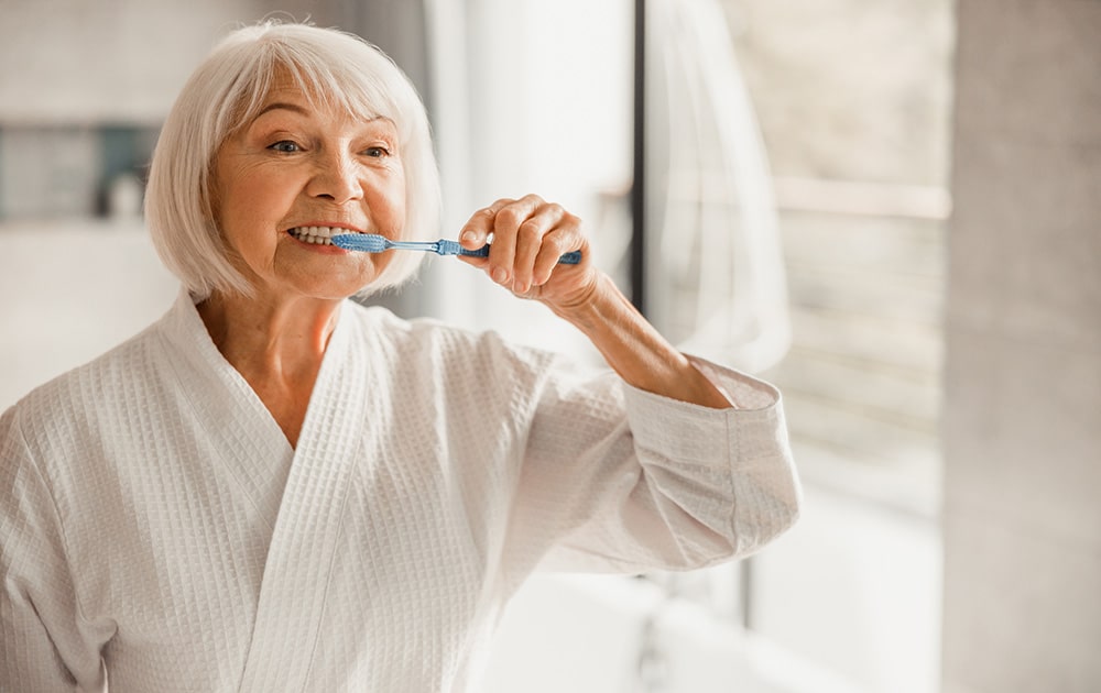 Senior woman sleeping peacefully while wearing dentures at night